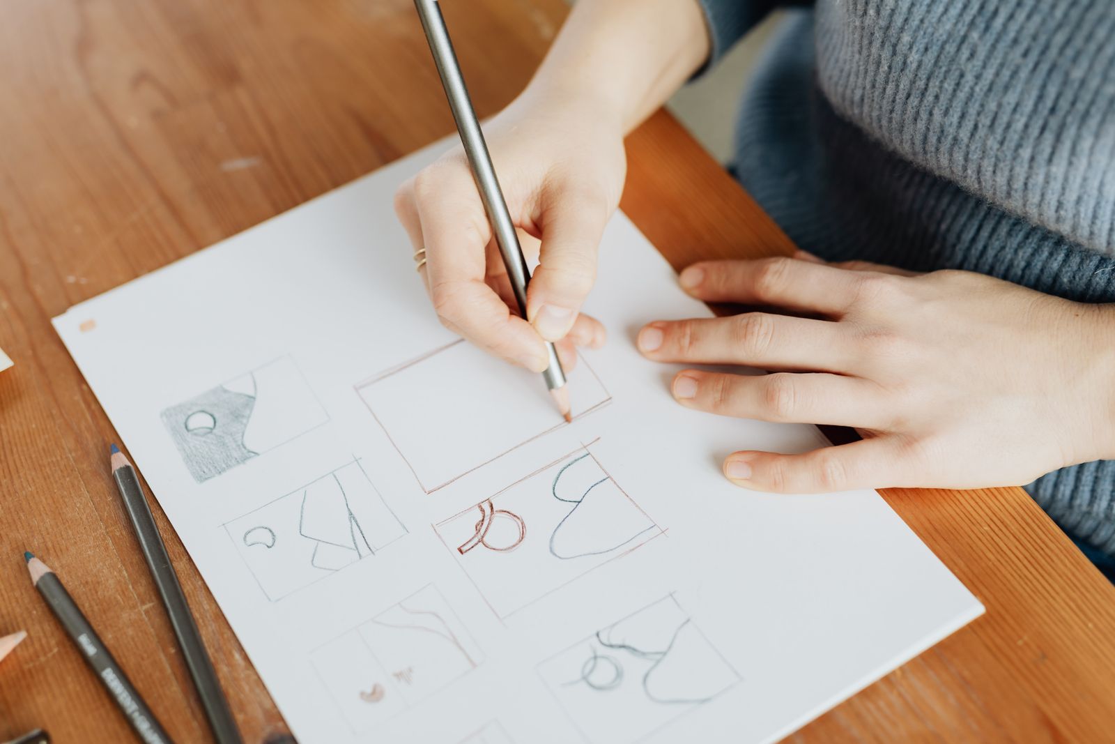 Graphic designer sketching logo concepts for a small business brand